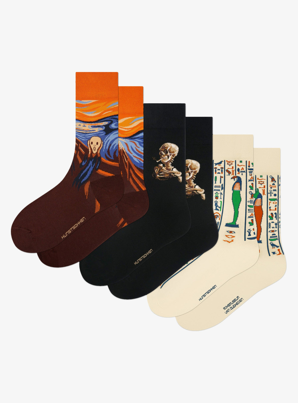 Spooky Masterpieces 3-Pack by Kunstsokken: The Scream, Skull of a Skeleton with Burning Cigarette and Sons of Horus socks side by side